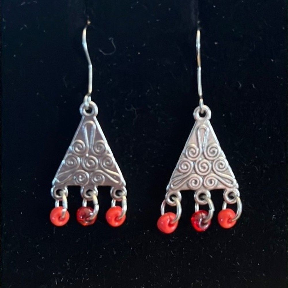 Handcrafted silver tone earrings with orange beads